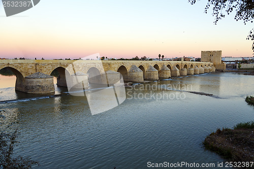 Image of Sunset in the Roman bridge as it passes through the river Guadalquivir in Cordoba