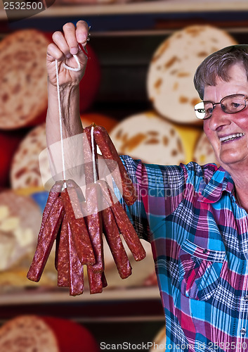 Image of butcher shop in Germany with female seller