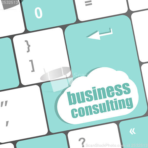 Image of Computer keyboard with business consulting key. business concept