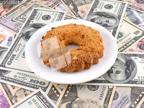 Image of cake on money dollars background