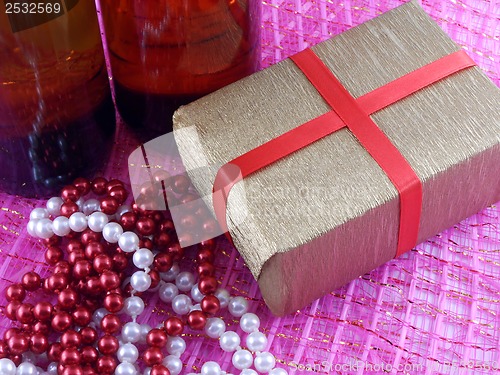 Image of Two champagne or wine bottle ready to bring in the New Year, luxury diamonds and gift boxes