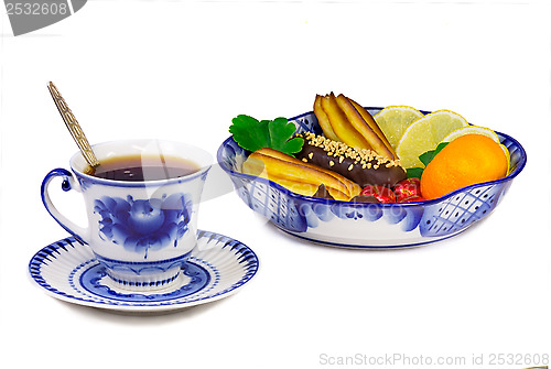 Image of Cup of tea, cakes, sweets, fruit bowl, painted in the style of t