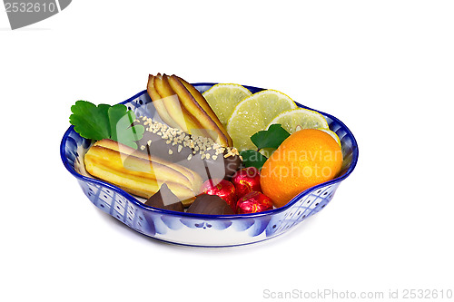 Image of Cakes, sweets, fruit in a vase, painted in the style of the "Gzh