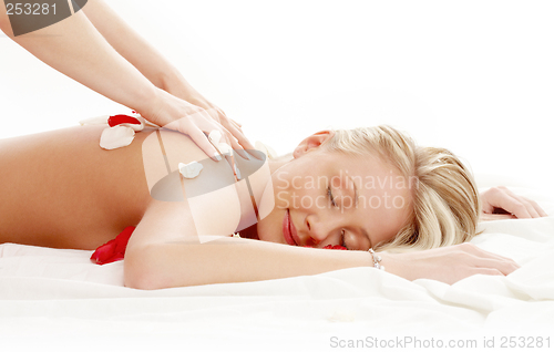 Image of professional massage with flower petals #2