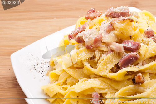 Image of pasta Carbonara with eggs bacon and parmesan