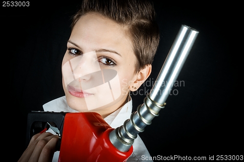 Image of Woman with fuel nozzle closeup