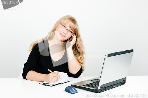 Image of Young woman in the office
