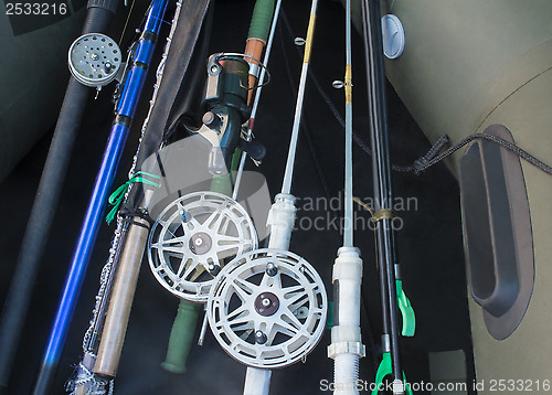 Image of Prepared for fishing, spinning, fishing rods, rubber boat.