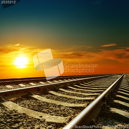 Image of orange sunset over railroad