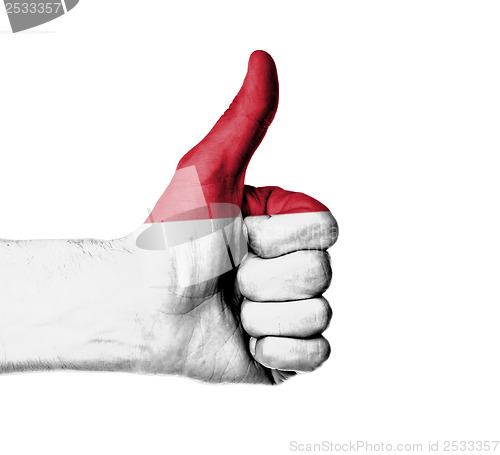 Image of Closeup of male hand showing thumbs up sign