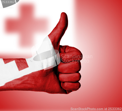 Image of Closeup of male hand showing thumbs up sign