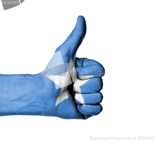 Image of Closeup of male hand showing thumbs up sign