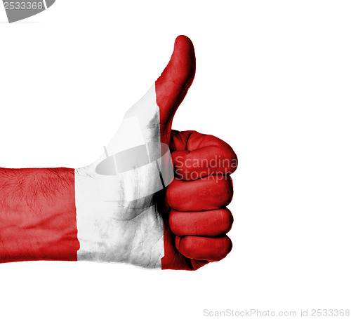 Image of Closeup of male hand showing thumbs up sign