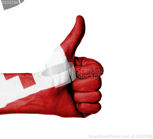 Image of Closeup of male hand showing thumbs up sign