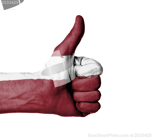 Image of Closeup of male hand showing thumbs up sign