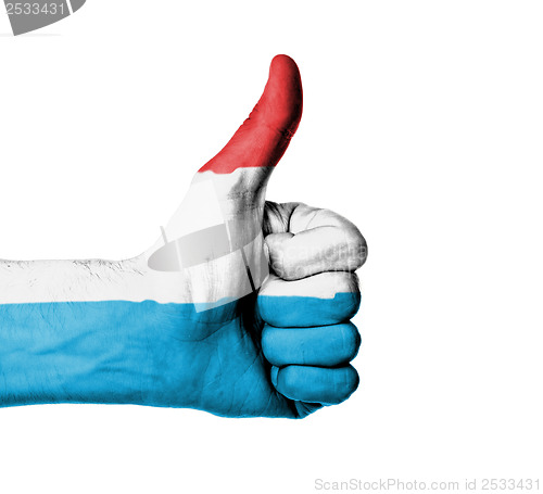 Image of Closeup of male hand showing thumbs up sign