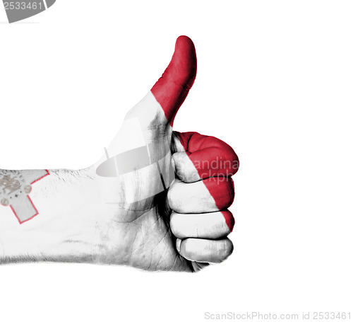 Image of Closeup of male hand showing thumbs up sign