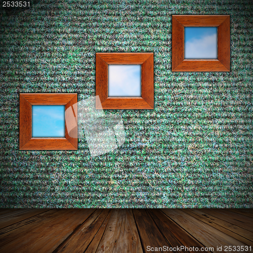 Image of indoor backdrop with frames on wall
