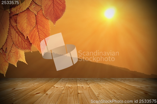 Image of sunset seen from wooden balcony