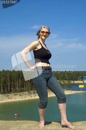 Image of Pretty woman at lake beach background