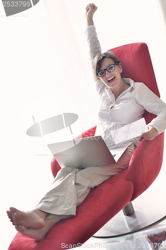 Image of woman using a laptop computer at home