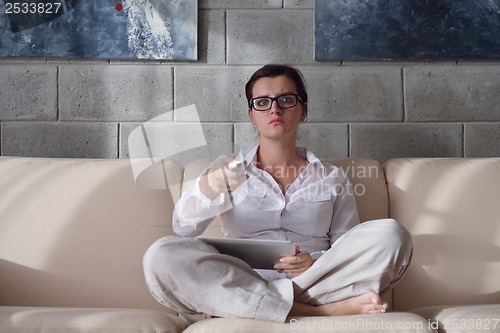 Image of woman using tablet pc at home