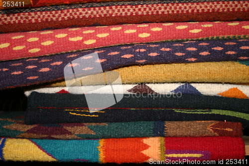 Image of Pile of colorful Mexican rugs