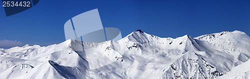 Image of Panoramic view on off-piste slopes and blue sky at nice day