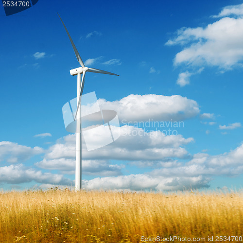 Image of Wind generator turbine on summer landscape