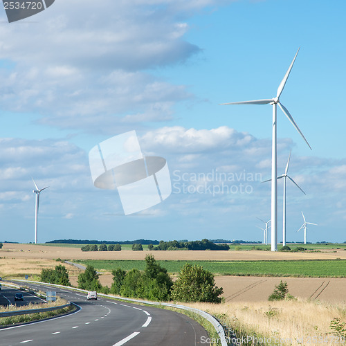 Image of Wind generator turbine on summer landscape