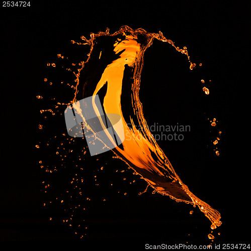 Image of orange water splash isolated on black