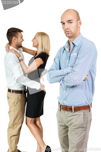 Image of young man unhappy jealous couple behind 