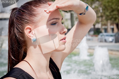 Image of attractive brunette young woman in summer outdoor 