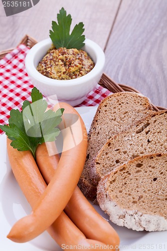 Image of tasty sausages frankfurter with grain bread 