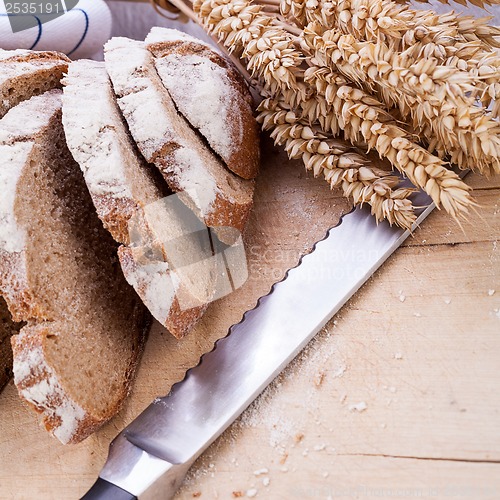 Image of homemade fresh baked bread and knife 
