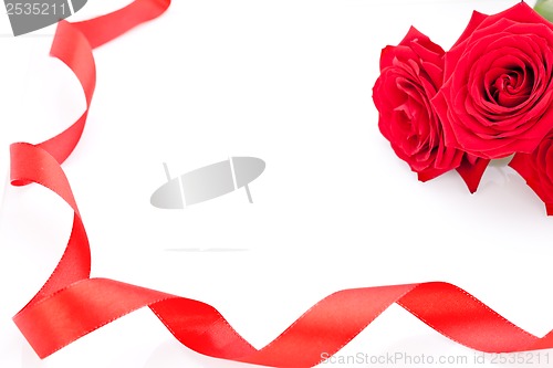 Image of Bouquet of red roses with ribbon border