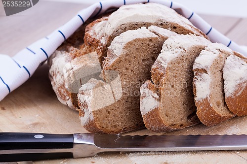 Image of homemade fresh baked bread and knife 