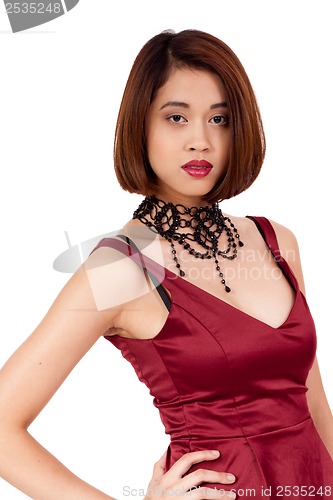 Image of young attractive asian woman with red lips and jewelry isolated