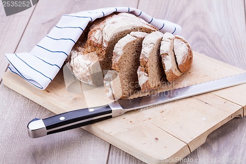 Image of homemade fresh baked bread and knife 