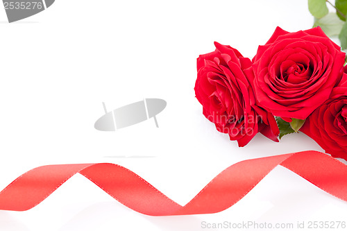 Image of Bouquet of red roses with ribbon border