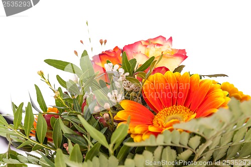 Image of Vivid orange gerbera daisy in a bouquet