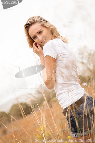 Image of young happy attractive woman arms wide open 