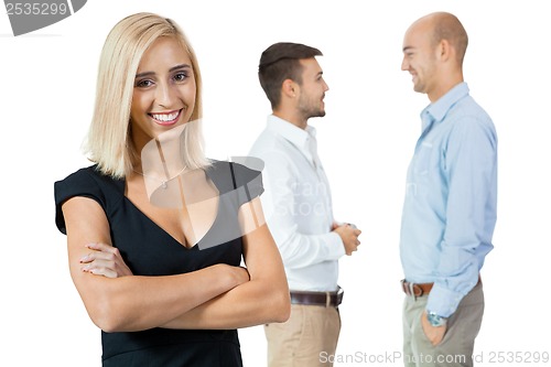 Image of young happy business woman team in background