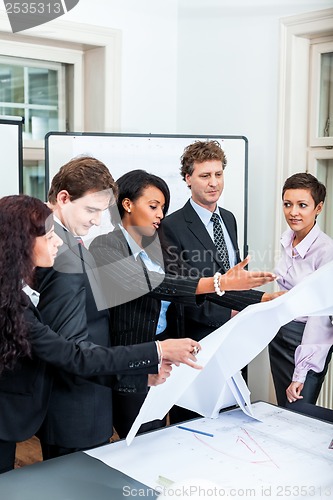 Image of business people discussing architecture plan sketch 