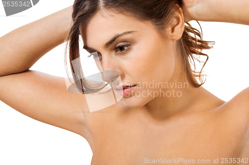 Image of beautiful young woman with perfect skin and soft makeup 
