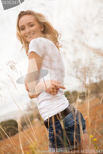 Image of young happy attractive woman arms wide open 