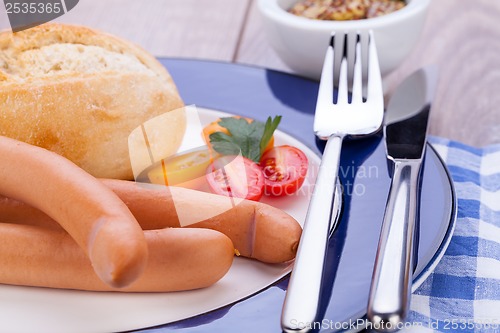 Image of tasty sausages frankfurter with grain bread 