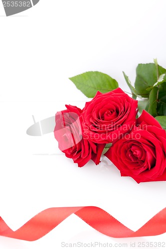 Image of Bouquet of red roses with ribbon border