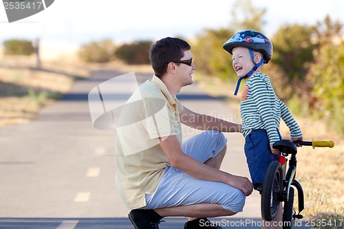 Image of family biking
