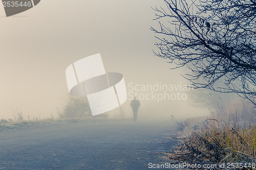 Image of men silhouette in the fog